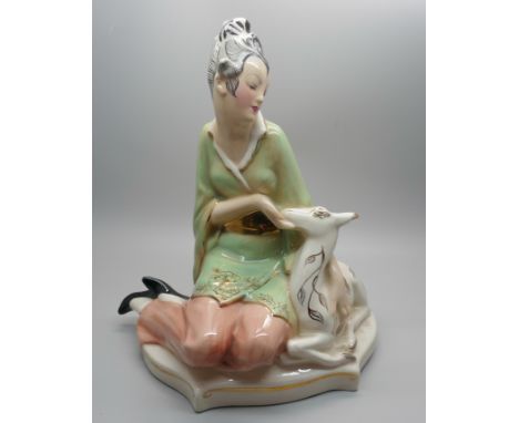 A 1950s Goldscheider figure of a seated Eastern lady stroking a deer, 22cm 