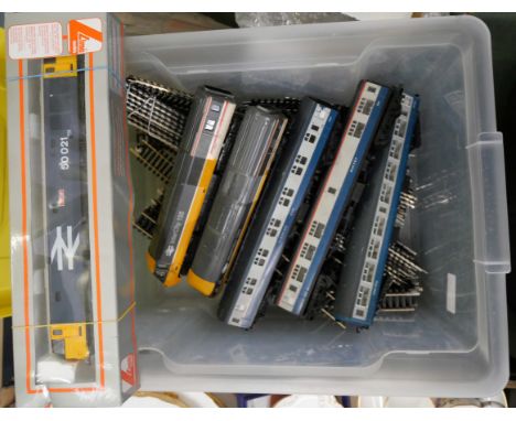 OO gauge model rail, a collection of track, a blue diesel engine, three Intercity coaches and two Intercity 125 engines 