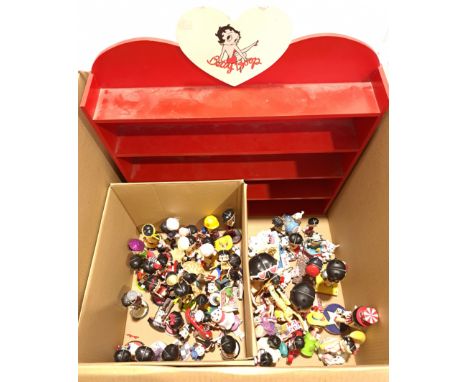 Quantity of Betty Boop Figurines with Themed Shelf. Includes Costumed Bettys, Baby Boops, Phrases Betty with others. Fair to 