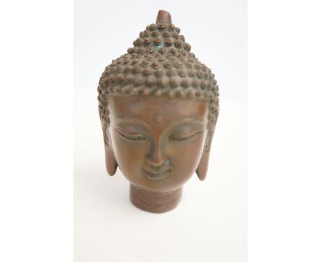 Bronze buddhas head signed to base Height 14 cm 