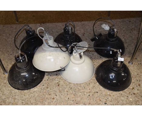 Group of seven industrial style pendant light fittings