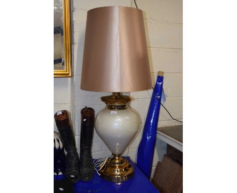 A large modern table lamp with tapering shade