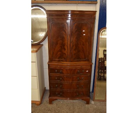 A flame mahogany veneered drinks cabinet