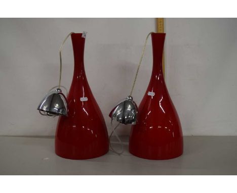 A pair of modern glass pendant light fittings