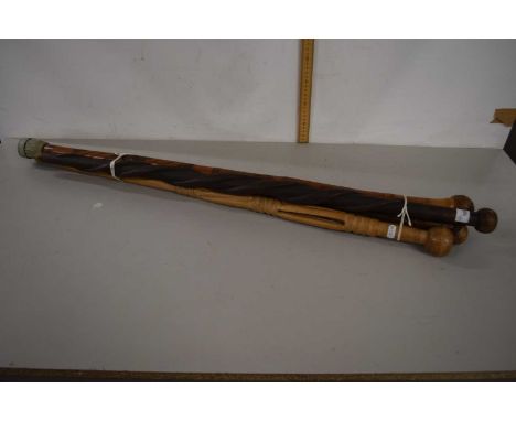 A group of four Knobkerrie type walking sticks