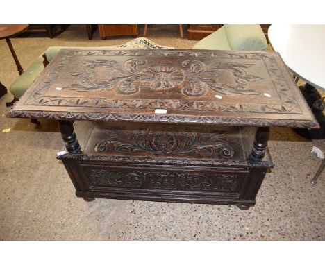 A late Victorian gothic oak monks bench, 107cm wide