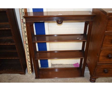 A reproduction open front wall shelf by Reprodux