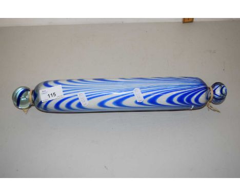 A swirled blue glass rolling pin