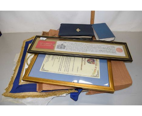A collection of various Masonic related items to include an Essex sash, a Masonic Bible, a copy of The Freedom of the City of