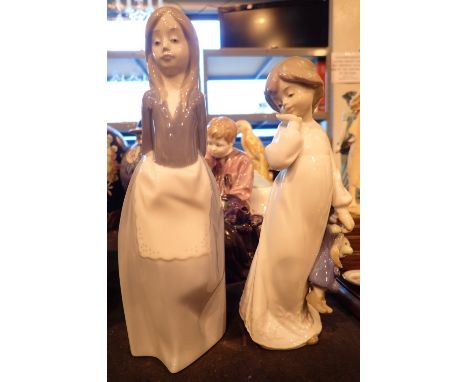 Two Nao figurines girl with teapot and another girl figurine 