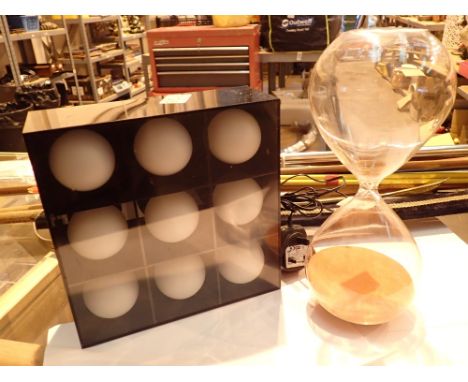 Small decorative light box with large hour glass 