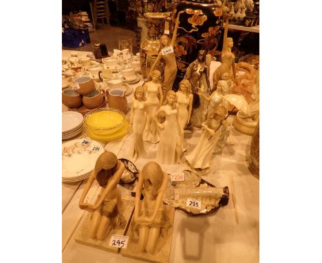 A quantity of ceramic and resin female figurines 