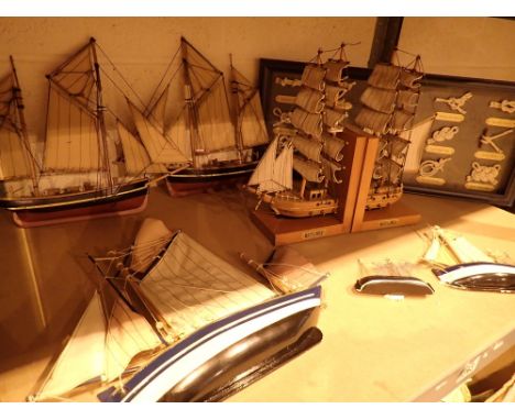 Shelf of wooden wall hanging ship models book ends etc 