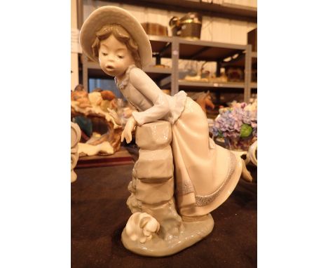 Nao figurine of young girl and puppy 