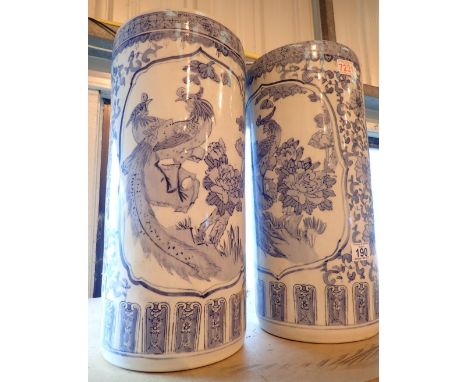A pair of blue and white Oriental style stick stands H : 46 cm 
