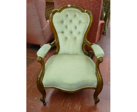 Medium sized button upholstered spoonback armchair
