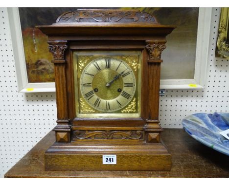 Carved front brass faced bracket clock