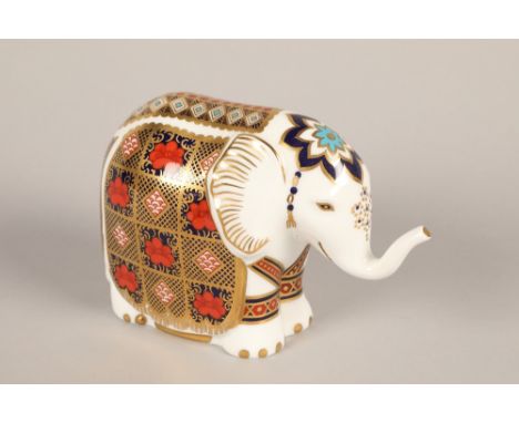 Royal Crown Derby Imari elephant paperweight; with gold button; 10cm high 