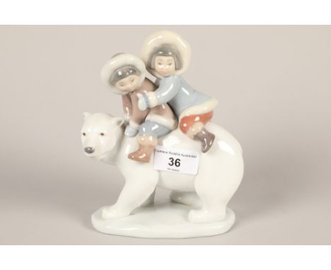 Lladro model of a polar bear with two children on its back; 19cm high 