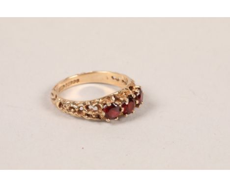 9 carat yellow gold three red stone ring; ring size M 1/2; gross weight 2.8g 