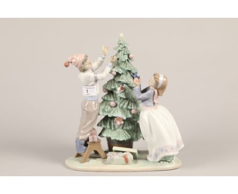 Lladro figure; Children decorating the Christmas Tree; 31cm highCONDITION REPORT:Star missing from top of tree, fore finger m