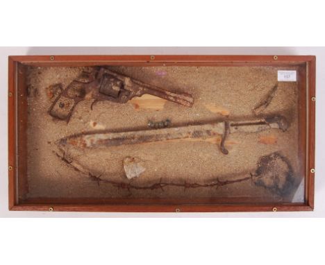 A collection of original WWI First World War battlefield relics - comprising officer's pistol, bayonet, shrapnel, and a piece