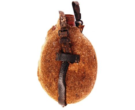 A rare WWI First World War German soldier's / infantry water bottle. With original field-green covering, with leather straps.