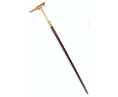 An antique early 20th century Edwardian walking stick cane - with telescope to handle. The wooden shaft, with brass mounted h