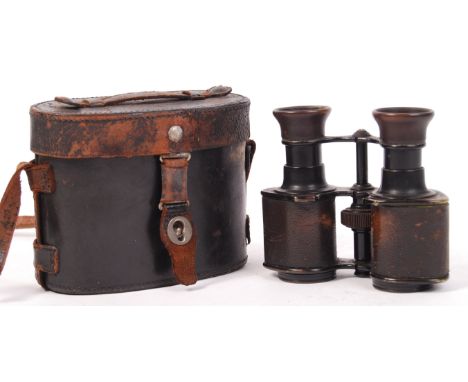A pair of antique WWI First World War binoculars - Vergross 5x 86-204. Leather grips, with central focus knob. Optics in good