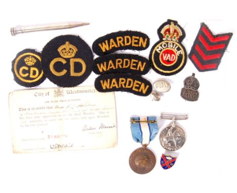 An interesting collection of assorted militaria / Civil Defense items, largely relating to a female ARP Warden in London. Com