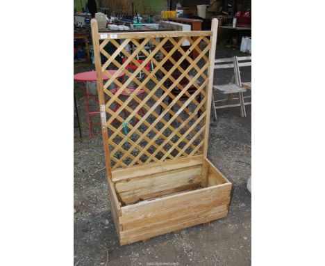 A wooden trellis planter, 2'7" x 1'4" x 4'6" high.