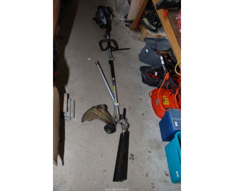 A "Titan" 2 in 1 petrol multi tool with strimmer and hedge trimming attachments, engine turns and has good compression.