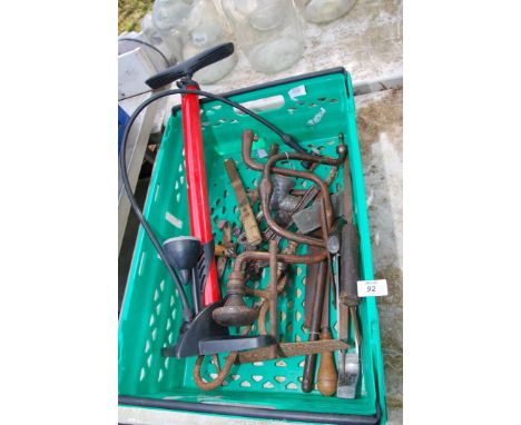 A box of hand tools, bicycle pump, chisels, etc.