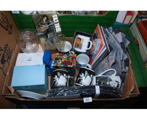A box of Elvis memorabilia, mugs, birthday cards etc.
