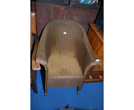A Lloyd loom tub chair.