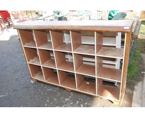 A set of pigeon holes and a white painted shelf unit 5ft x 3 ft.
