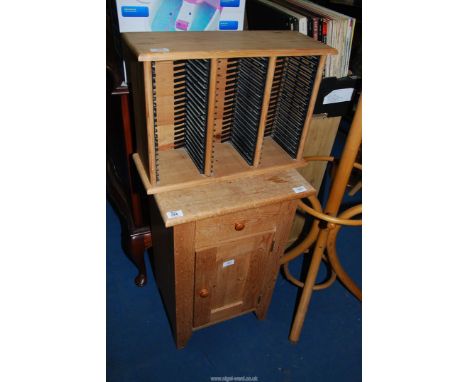A Pine Pot Cupboard and CD rack.