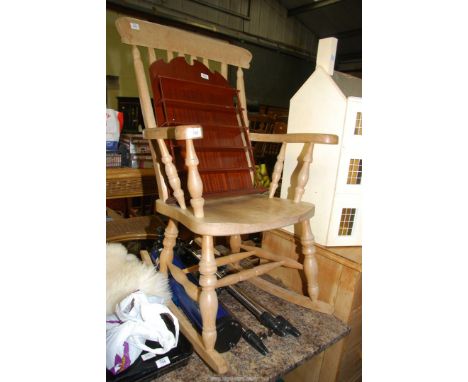 A rocking Chair and display shelf.