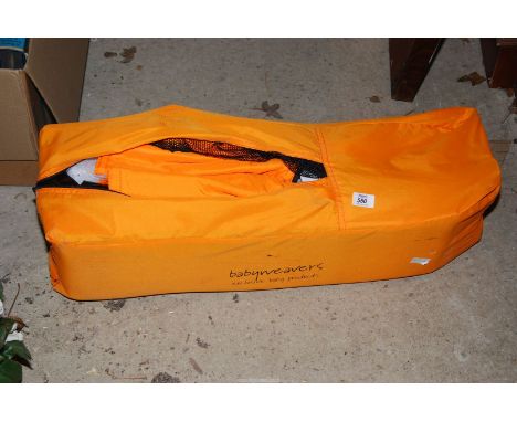 A Travel cot.