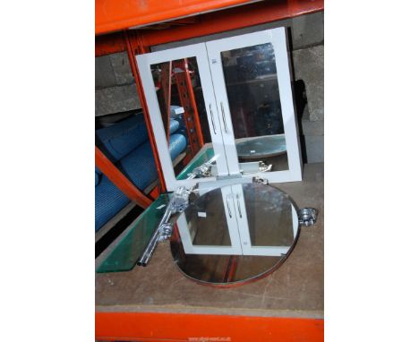 A mirrored bathroom cabinet, light, mirror and shelf.
