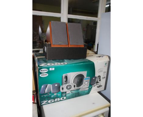 A "Logitech" surround sound system, plus a pair of "Sony" speakers.