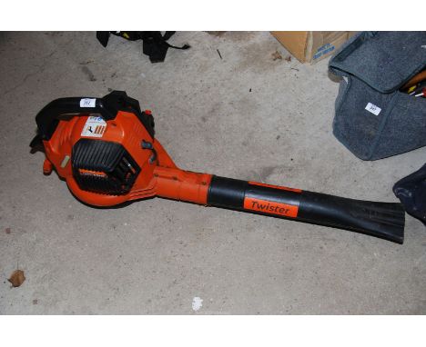 A "Flymo" Twister petrol garden blower. Engine turns and has good compression.