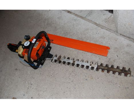 A "Stihl" HS 75 petrol hedge trimmer, engine turns and has good compression.