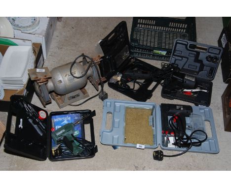 A "Hilka" 6" bench grinder, staple gun, wheel nut remover, screwdriver, etc.