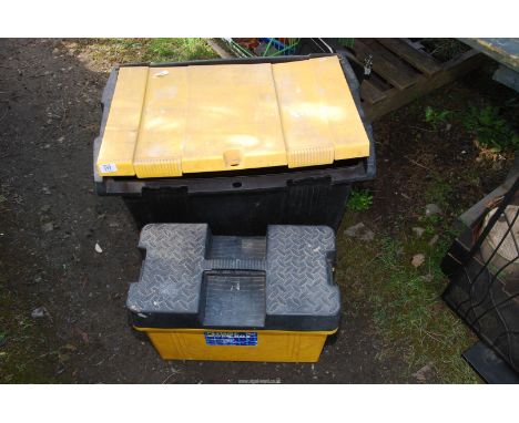 A large plastic tool box and a portable tool box.