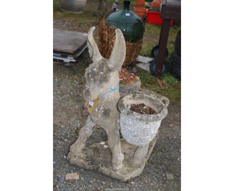 A concrete Donkey planter.