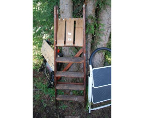 A wooden step ladder.
