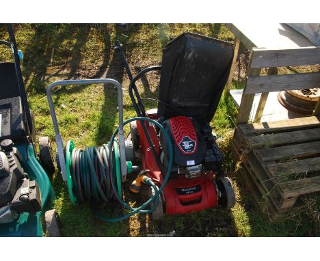 A hose on portable reel and a Mountfield HP 414  lawn mower [engine turns and has good compression].