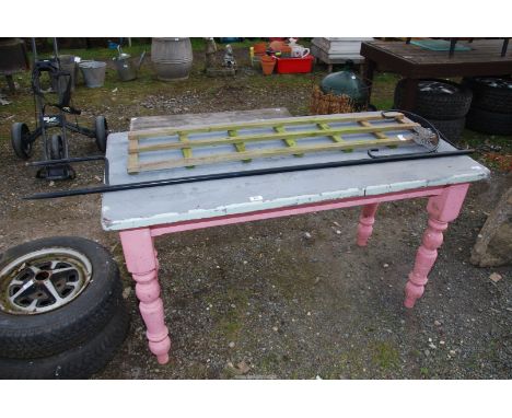A Pine table painted pink and grey, 54" wide x 27" depth x 31" high, plus a piece of trellis and a hanging basket bracket.