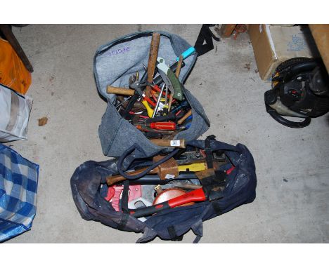 Two bags of tools, mallet, axe, chisels, etc.
